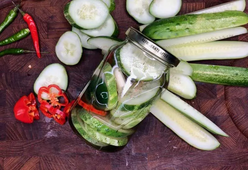 Fresh made pickles cooling on cutting board