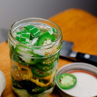 Pickled jalapeno peppers in jar.