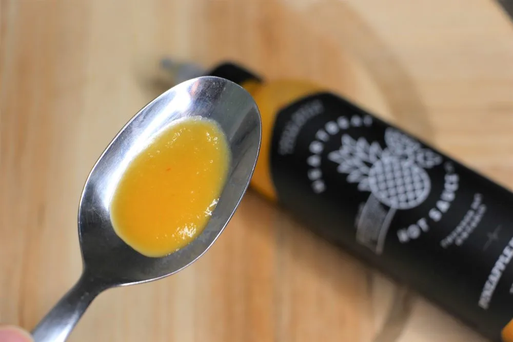 Heatbeat pineapple habanero sauce on spoon