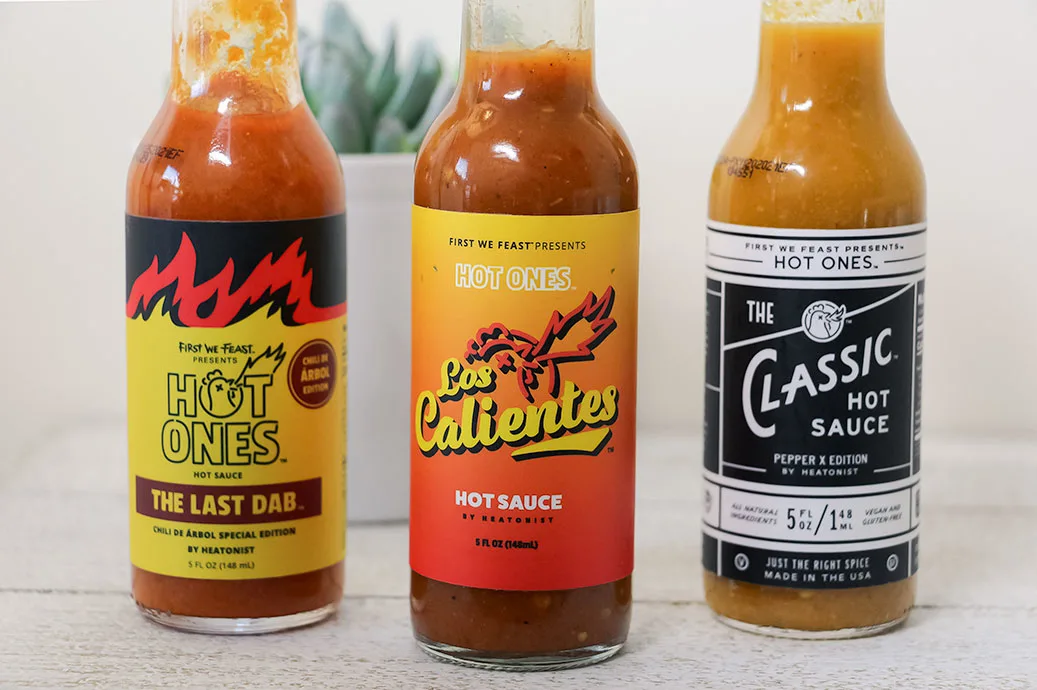 Hot Ones 3 New Sauce bottle labels: The Las Dab Chile De Arbol Edition, Los Calientes Rojo, and The Classic Pepper X Edition