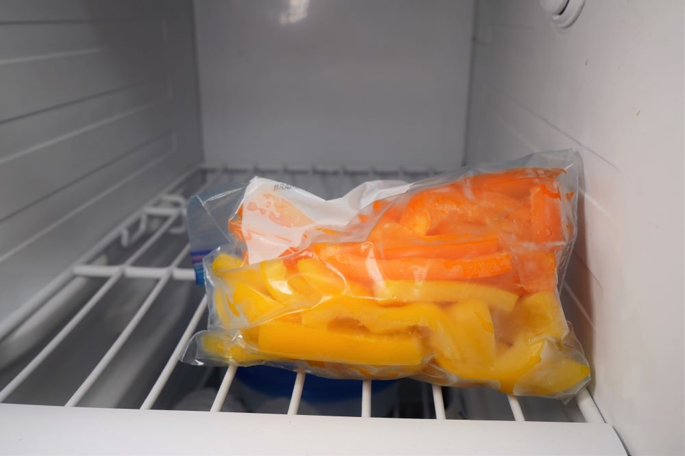 Frozen bell peppers in freezer