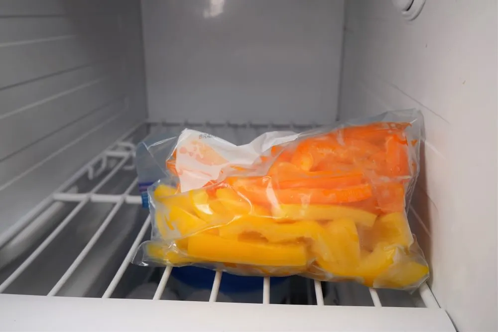 Stock Up On Winter Food. Chef Puts Bell Pepper Into Plastic Container For  Freezing. Stock Photo, Picture and Royalty Free Image. Image 65590921.