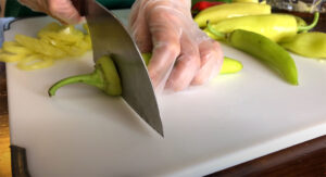 Cutting off stems from banana peppers