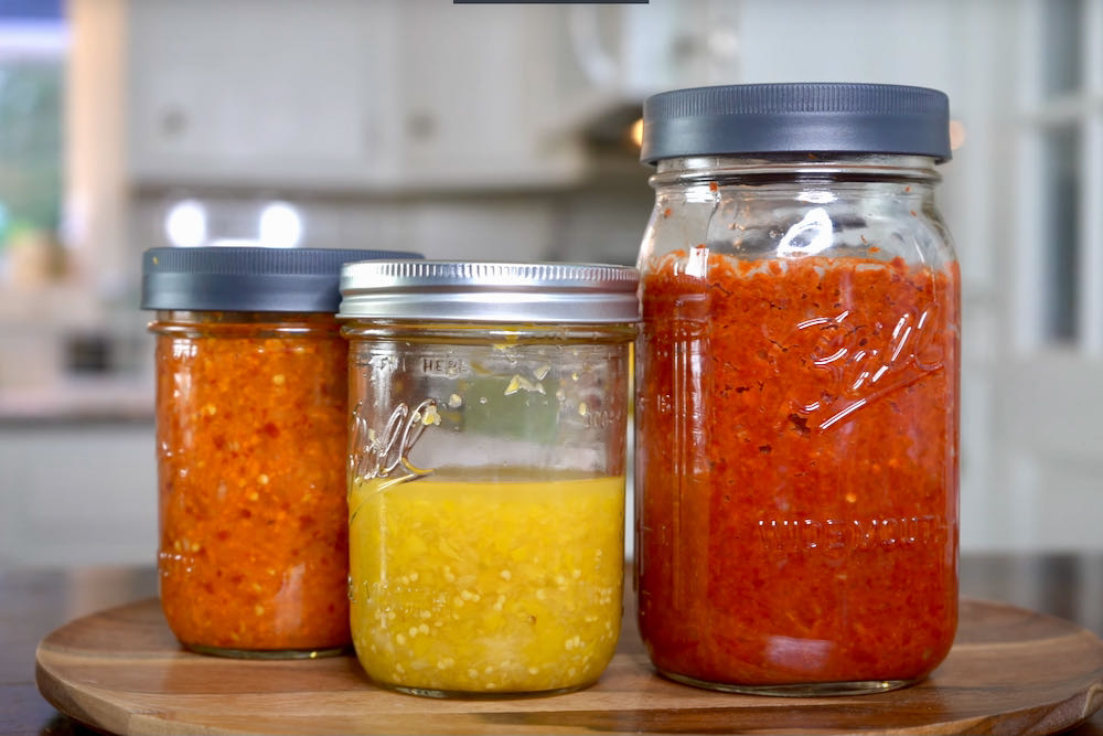 Fermented pepper mashes in glass ball jars