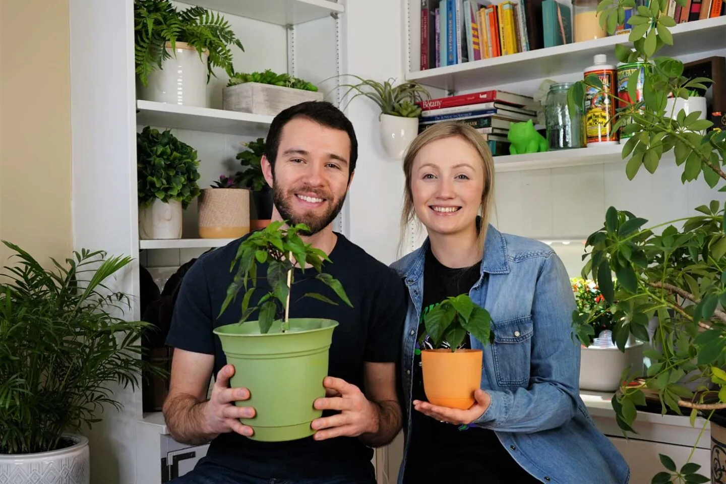 Calvin and Crystalyn Holding Pepper Plants