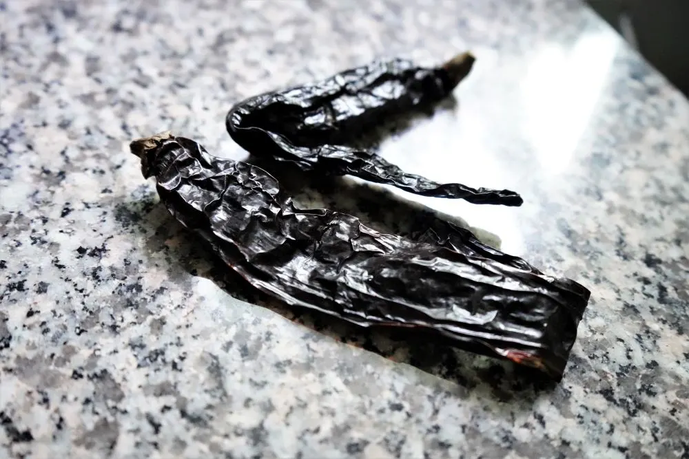 Two (2) dried pasilla peppers