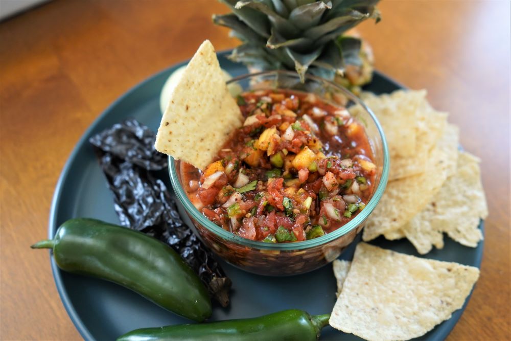 Pineapple jalapeno salsa in bowl with tortilla chips