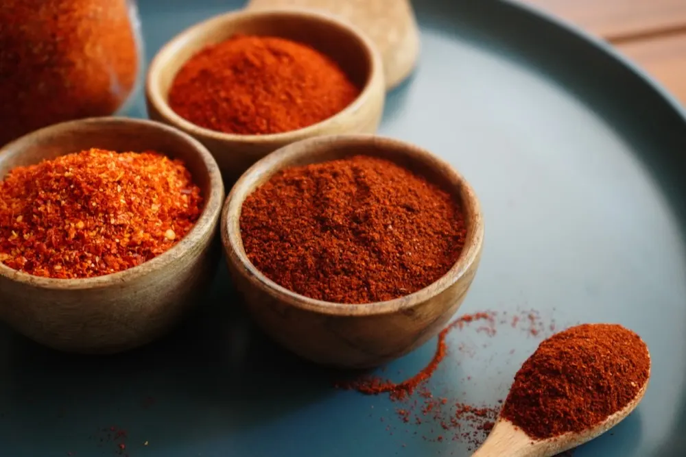 Chili powder in wooden bowl