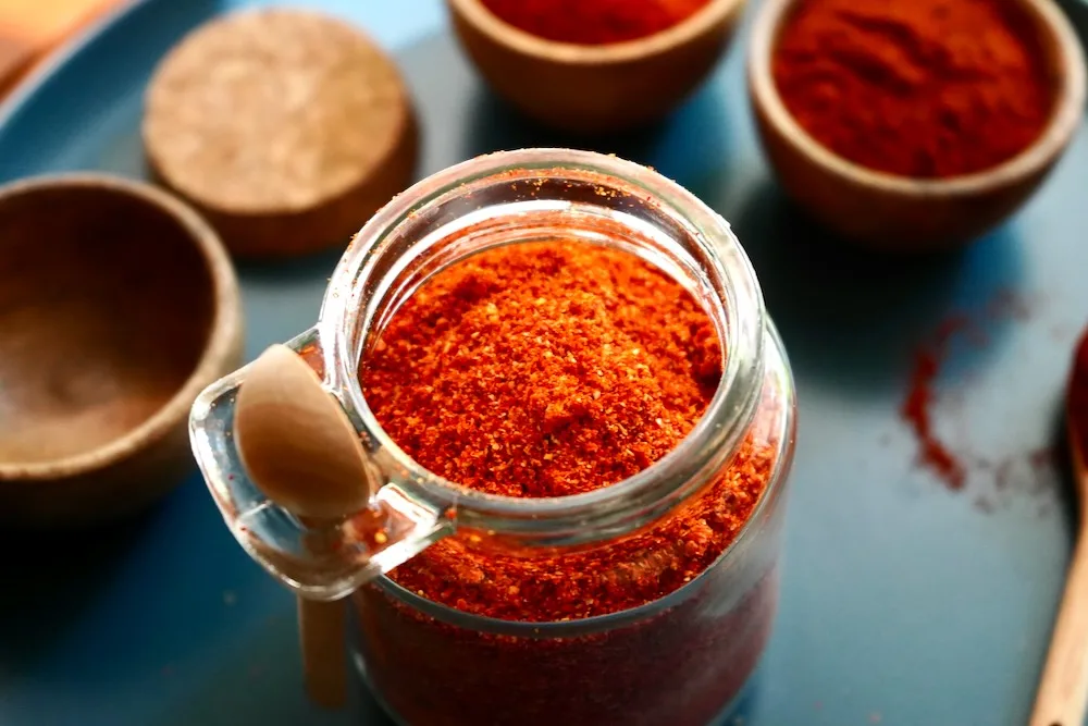 Homemade cayenne pepper powder in glass jar