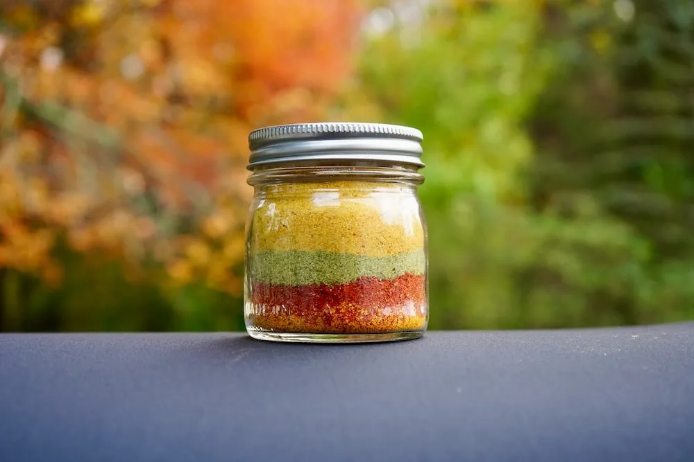 Mixed pepper powders in a ball jar