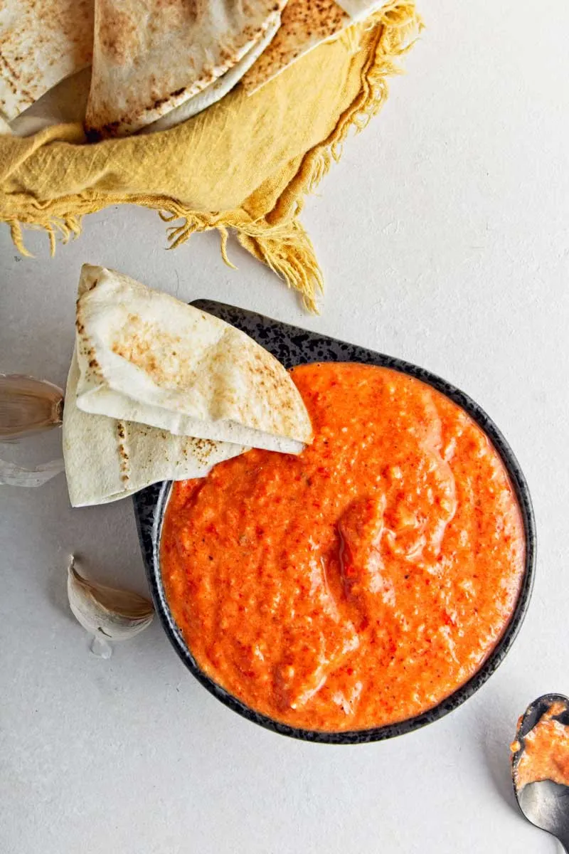 Roasted red pepper dip with pita bread.