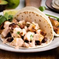 Easy chipotle chicken tacos with chipotle sauce on plate