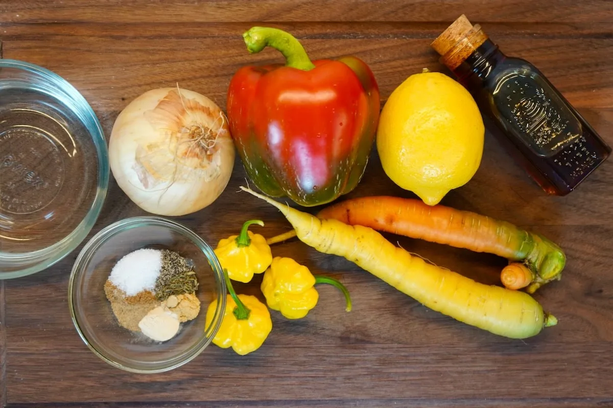 Scotch bonnet hot sauce ingredients on cutting board