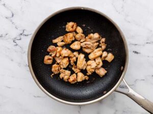 Kung Pao chicken cooking in pan