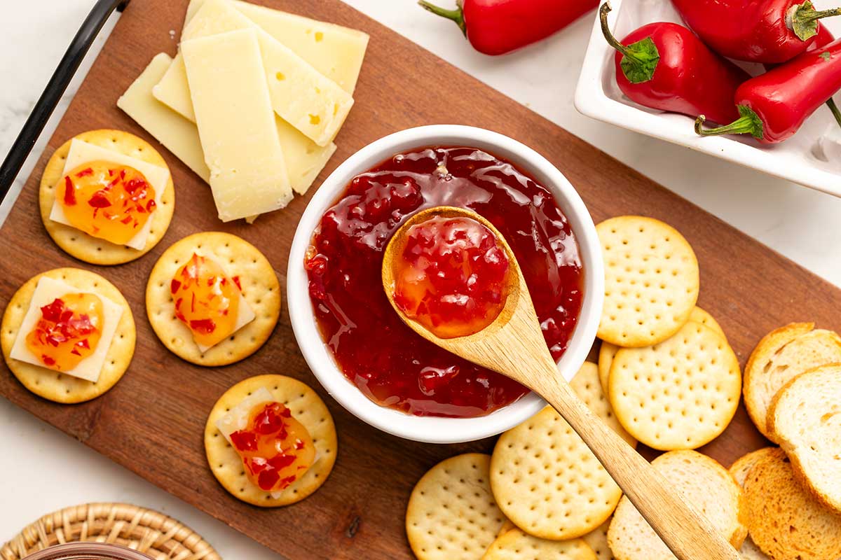 Peach hot pepper jelly with crackers and cheese