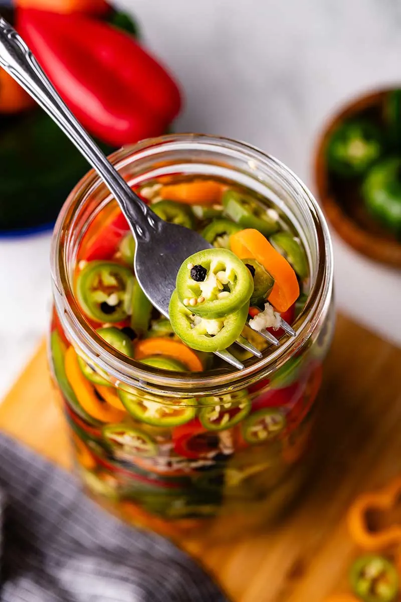 Quick pickled peppers on fork