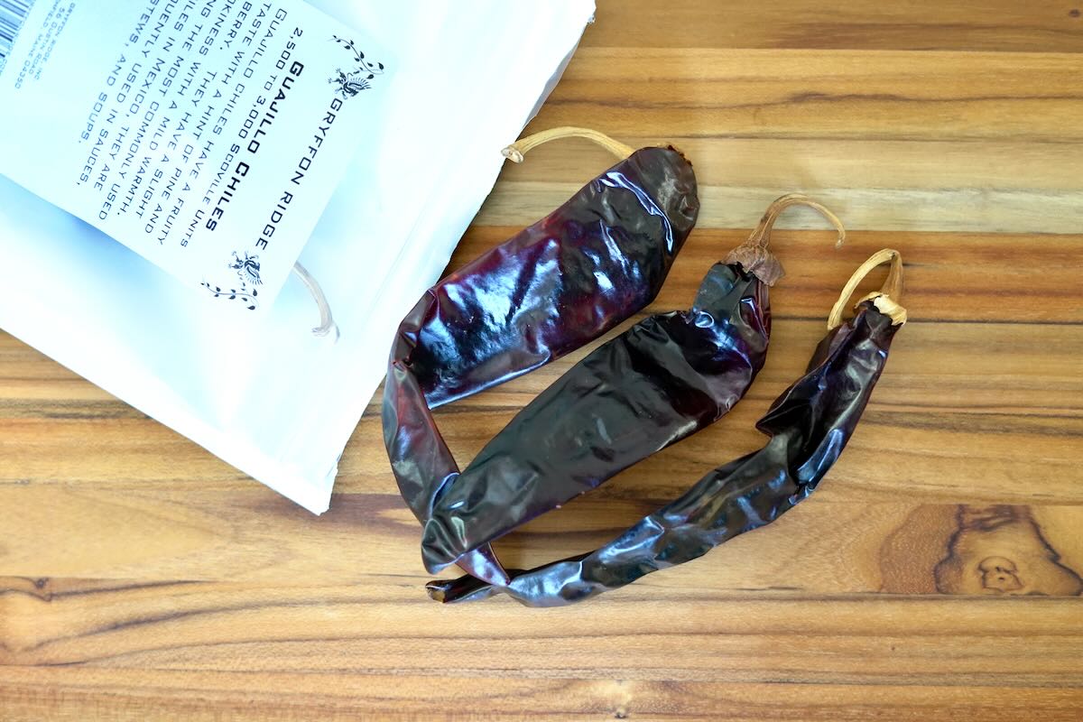 Guajillo chile peppers on cutting board