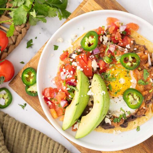 Overhead shot of plated huevos rancheros