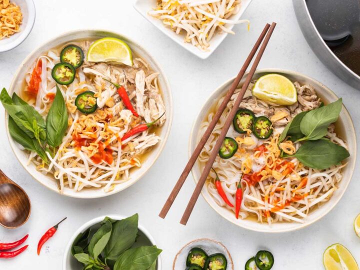 Overhead shot of two bowls of homemade chicken pho