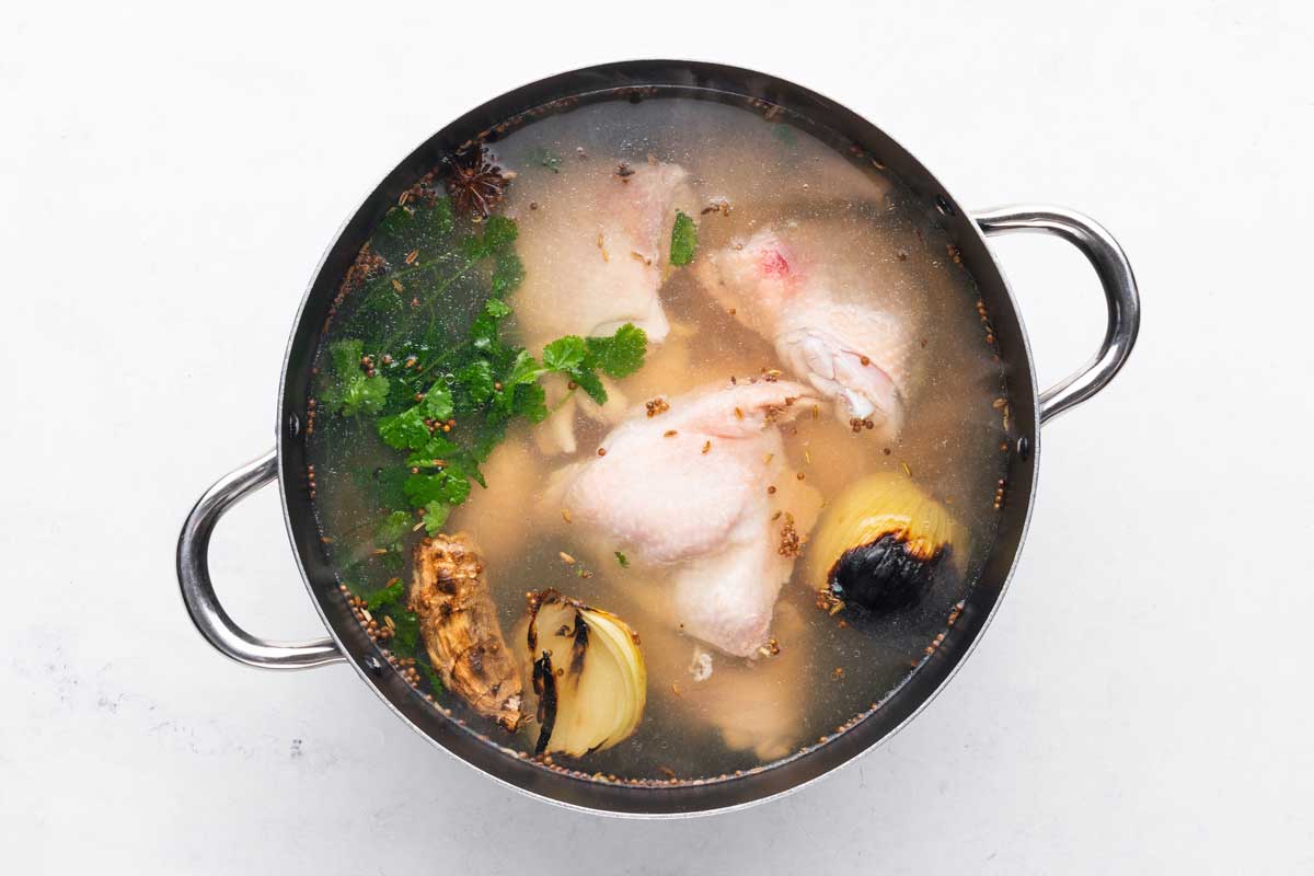 Simmering pho broth