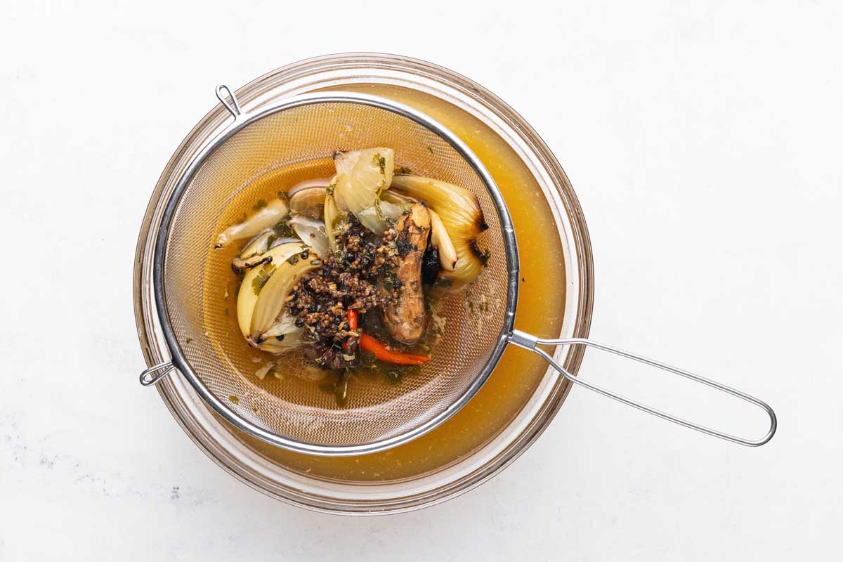 Straining pho broth